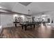 Enjoy the game room with a shuffleboard table, pool table, and lounge space at 2511 W Queen Creek Rd # 323, Chandler, AZ 85248
