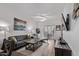 Cozy living room with modern decor, stylish furniture, and wood-look tile flooring at 2511 W Queen Creek Rd # 323, Chandler, AZ 85248