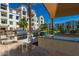 Outdoor kitchen with built-in BBQs and counter space by the pool, perfect for poolside entertaining at 2511 W Queen Creek Rd # 323, Chandler, AZ 85248