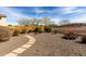 Desert landscaped backyard offering a serene and low-maintenance outdoor space at 26057 W Sequoia Dr, Buckeye, AZ 85396