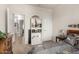 Well-lit bedroom with an open doorway and ample natural light coming in from the window at 26057 W Sequoia Dr, Buckeye, AZ 85396