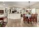 Open concept dining room next to kitchen with natural light and tile flooring at 26057 W Sequoia Dr, Buckeye, AZ 85396