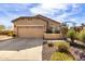 Charming single-story home featuring a well-manicured front yard and a two-car garage at 26057 W Sequoia Dr, Buckeye, AZ 85396