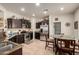 Kitchen featuring stainless steel appliances, tile flooring and dark wood cabinetry at 26057 W Sequoia Dr, Buckeye, AZ 85396