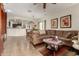Spacious living room featuring tile flooring, neutral tones and a view of the open concept kitchen at 26057 W Sequoia Dr, Buckeye, AZ 85396