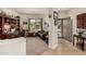 Spacious living area with a built-in desk, neutral carpet, and plenty of natural light coming in through the window at 26057 W Sequoia Dr, Buckeye, AZ 85396