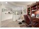 Cozy office space with built-in shelving and comfortable seating in an open-concept design at 26057 W Sequoia Dr, Buckeye, AZ 85396