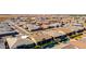An aerial view of a neighborhood showcasing modern houses, well-maintained streets, and inviting pools in several backyards at 26199 S 227Th St, Queen Creek, AZ 85142