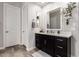 Bathroom with a dark vanity with a white countertop, light grey walls and modern fixtures at 26199 S 227Th St, Queen Creek, AZ 85142