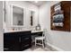 Well-lit bathroom with double vanity, makeup vanity, and modern decor at 26199 S 227Th St, Queen Creek, AZ 85142