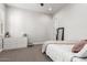 Bright bedroom with a large dresser, full length mirror and neutral tones at 26199 S 227Th St, Queen Creek, AZ 85142