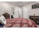 Bedroom featuring a large bed and a view into the ensuite bathroom at 26199 S 227Th St, Queen Creek, AZ 85142
