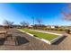 Bocce ball court surrounded by desert landscaping and bench seating at 26199 S 227Th St, Queen Creek, AZ 85142