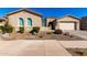 Inviting exterior view of a home showcasing an attached garage and landscaped front yard with desert flora at 26199 S 227Th St, Queen Creek, AZ 85142