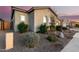 Well-maintained home with desert landscaping, arched windows, and a neutral color scheme at 26199 S 227Th St, Queen Creek, AZ 85142