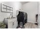 Neat laundry room with a black washer and dryer and utility sink at 26199 S 227Th St, Queen Creek, AZ 85142