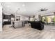Open-concept living space with seamless flow from kitchen to dining to living room, ideal for entertaining at 26199 S 227Th St, Queen Creek, AZ 85142