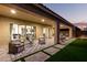 Outdoor patio with furniture, artificial turf and a grilling station at 26199 S 227Th St, Queen Creek, AZ 85142