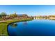 Picturesque pond with lakeside amenities, walking paths, and charming neighborhood views at 26199 S 227Th St, Queen Creek, AZ 85142