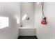Modern shower with textured white tiles, a built-in bench, and sleek fixtures at 26199 S 227Th St, Queen Creek, AZ 85142