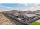 Aerial view of home with pool, desert landscaping, and mountain views at 28883 N 131St Dr, Peoria, AZ 85383