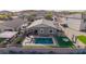 Aerial view of fenced backyard with pool, patio, and artificial turf at 28883 N 131St Dr, Peoria, AZ 85383
