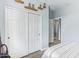 Bedroom features a closet with sliding doors and an open doorway at 28883 N 131St Dr, Peoria, AZ 85383