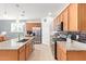 Spacious kitchen with tile floors, stainless steel appliances, and granite countertops at 28883 N 131St Dr, Peoria, AZ 85383