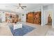 Open-concept living space featuring a large entertainment center and seamless access to the kitchen at 28883 N 131St Dr, Peoria, AZ 85383