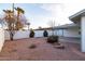 Desert landscaped backyard featuring covered patio and mature trees at 2907 S Elm St, Tempe, AZ 85282