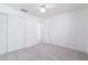 This bedroom features a ceiling fan, closet, and carpet flooring at 2907 S Elm St, Tempe, AZ 85282
