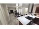 Dining room with modern kitchen, wood table and chairs, and wood-look flooring at 2907 S Elm St, Tempe, AZ 85282