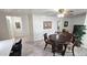 Bright dining area features wood table, ceiling fan, decorative light and wood-look flooring at 2907 S Elm St, Tempe, AZ 85282