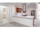 This kitchen features custom cabinets, stainless steel appliances, granite countertops, and an island at 2907 S Elm St, Tempe, AZ 85282