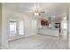 Open-concept living room leading into the kitchen with stainless steel appliances and modern fixtures at 2907 S Elm St, Tempe, AZ 85282