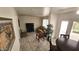 Open-concept living and dining area with lots of natural light, modern furniture, and wood-look floors at 2907 S Elm St, Tempe, AZ 85282