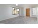 Bright living room with a large window and wood-style flooring, perfect for relaxing and entertaining at 2907 S Elm St, Tempe, AZ 85282