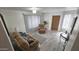 Inviting living room with cozy sofa, recliner, front door, large window with blinds and wood-look flooring at 2907 S Elm St, Tempe, AZ 85282