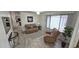 Cozy living room with neutral colors, comfortable seating, large window with blinds and wood-look flooring at 2907 S Elm St, Tempe, AZ 85282