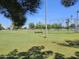 Expansive grassy park with a baseball field, benches, and trees, providing a recreational area for outdoor activities at 2907 S Elm St, Tempe, AZ 85282
