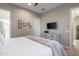 Comfortable bedroom featuring a dresser, decorative wall art, and a modern ceiling fan at 34801 N 53Rd St # 29, Cave Creek, AZ 85331