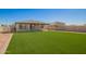 Spacious backyard with artificial grass offers a low-maintenance outdoor space at 35 S Siena Ln, Casa Grande, AZ 85122