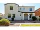 Inviting two-story home with a stucco facade, covered entryway, and well-maintained landscaping at 3555 E Erie St, Gilbert, AZ 85295