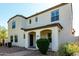 Charming home featuring a covered entrance with arches, complemented by desert landscaping and a paver walkway at 3555 E Erie St, Gilbert, AZ 85295