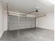Spacious garage with a large gray door, offering plenty of parking and storage space at 3555 E Erie St, Gilbert, AZ 85295