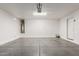 Large and clean garage featuring an automatic door and plenty of open space at 3555 E Erie St, Gilbert, AZ 85295