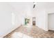 Sunlit living room features tile floors, large windows, and a view of the backyard at 3555 E Erie St, Gilbert, AZ 85295