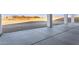 Covered back patio with sturdy columns, sleek concrete flooring, and views of the expansive yard at 36321 N 16Th St, Phoenix, AZ 85086