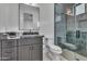 Stylish bathroom featuring marble countertop vanity, framed mirror, and a glass-enclosed shower at 36321 N 16Th St, Phoenix, AZ 85086