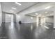 A spacious three car garage, with an epoxy floor, ample lighting, and a white door at 36321 N 16Th St, Phoenix, AZ 85086